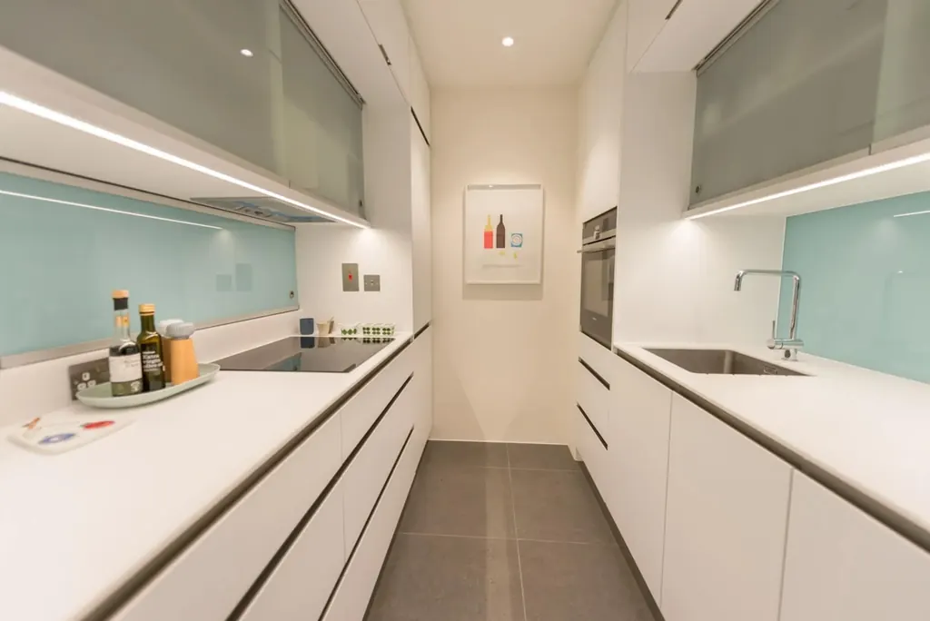 White cabinet fronts meeting a quartz worktop with crisp edges
